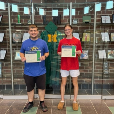 students smiling holding certificate